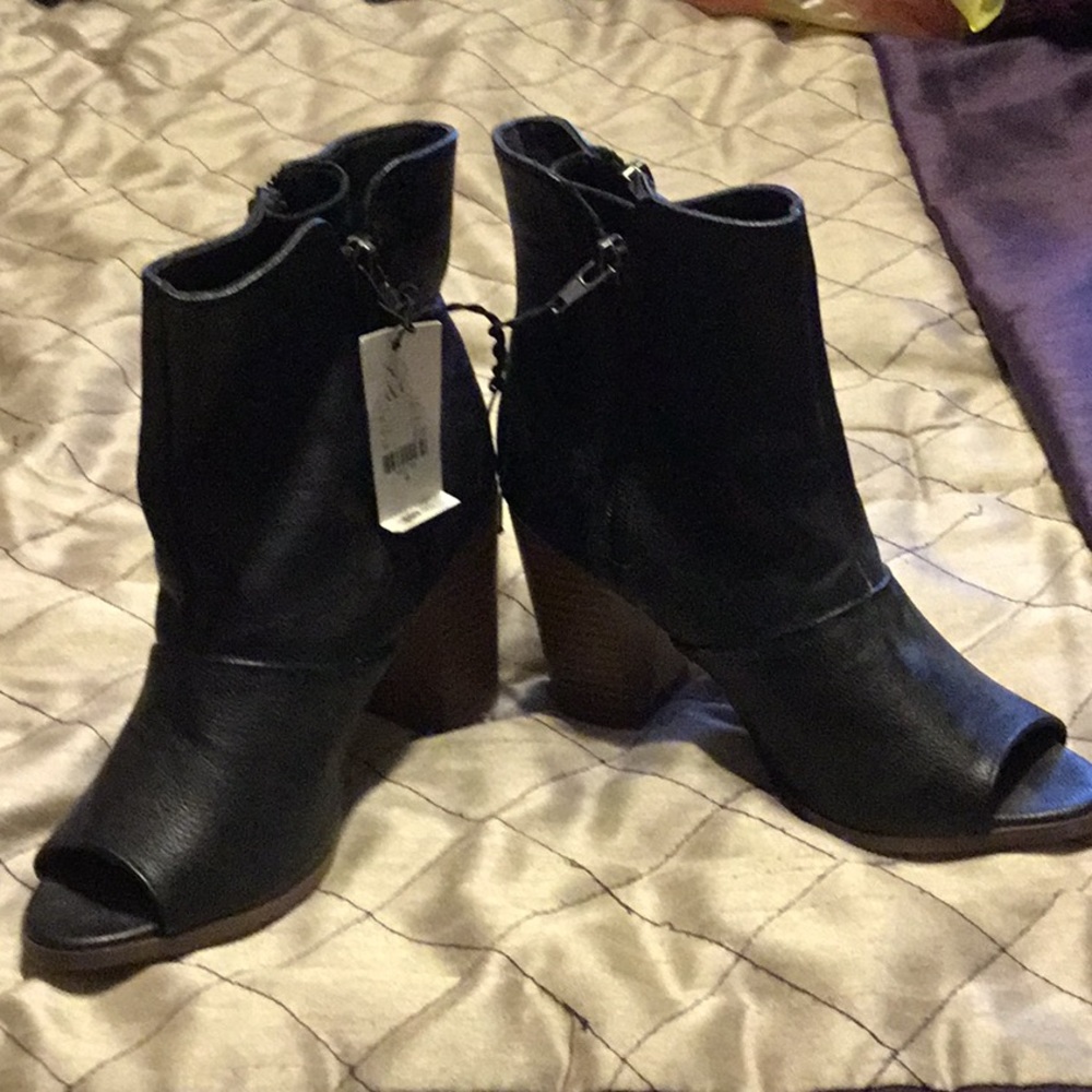 Black peakaboo toe boots.  NWT size 6